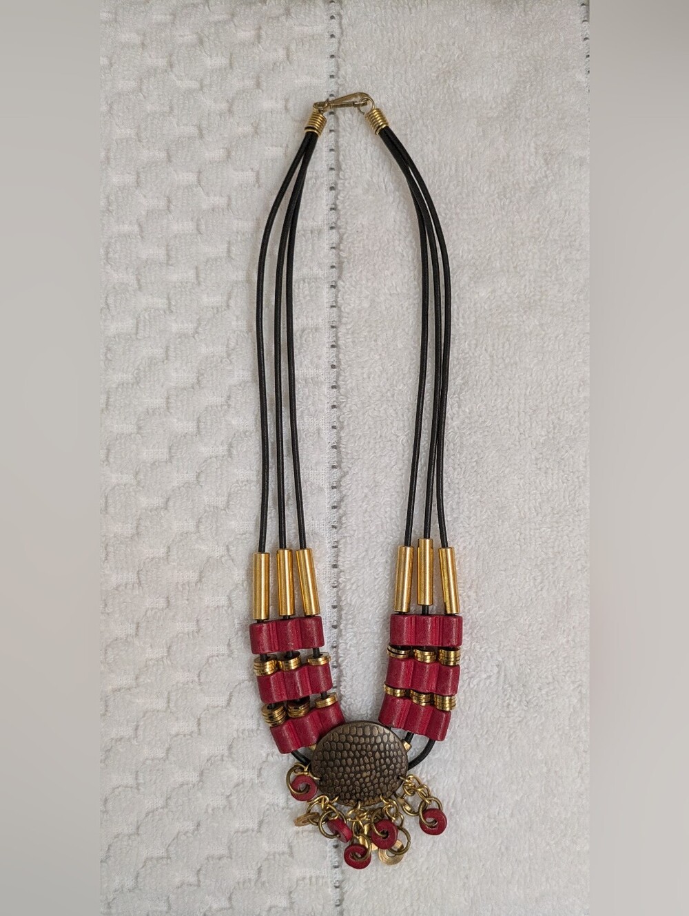 Multi-Strand Black Cord Necklace with Red Accents and Gold Hardware